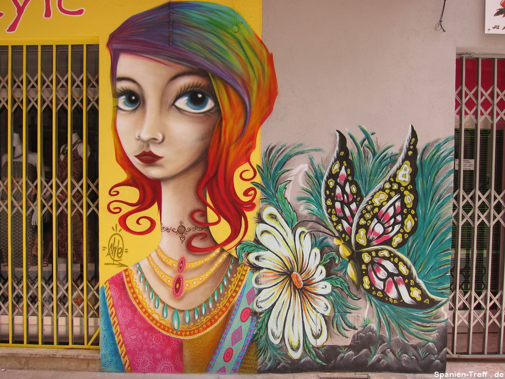 Graffiti und Geschäftsbemalung: Frau mit Blume und Schmetterling